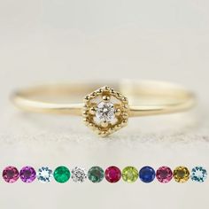 Elevate your style with our exquisite 14k birthstone ring, delicately crafted to add a touch of elegance to any ensemble. Featuring a dainty design, this versatile piece is perfect for stacking or wearing solo, offering endless styling possibilities. The milgrain finish on the setting lends a vintage charm to the mesmerizing gemstone, making it an ideal choice for special occasions or everyday wear. Whether it's a birthday, anniversary, Christmas, or Mother's Day, this stunning ring makes for a Dainty Diamond Birthstone Stackable Rings, Dainty Diamond Stackable Rings With Birthstone, Dainty Cubic Zirconia Birthstone Promise Ring, Heirloom Diamond Ring With Birthstone In Round Cut, Dainty Birthstone Ring With Single Diamond, Delicate Diamond Birthstone Ring, Delicate Diamond Birthstone Ring With Round Band, Fine Jewelry Birthstone Ring With Single Diamond For Promise, Stackable Diamond Birthstone Ring For Promise