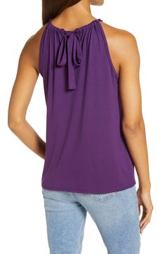 A stretchy knit and a shoulder-showing design put this halter-neck tank at the top of both the comfy and cute wardrobe rankings. 23" length Ties at neck Halter neck Sleeveless, with cutaway shoulders 95% rayon, 5% spandex Machine wash, dry flat Imported Women's Clothing Versatile Sleeveless Halter Top With Tie Back, Casual Stretch Halter Top Sleeveless Blouse, Casual Stretch Halter Top, Casual Solid Halter Tank Top, Casual Solid Halter Neck Top, Casual Solid Color Tank Halter Top, Versatile Stretch Camisole Top, Versatile Sleeveless Top With Tie Back, Solid Color Cotton Halter Neck Tops