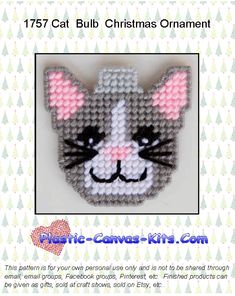 an ornament with a cat's face made out of plastic beads and thread