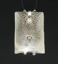 Sterling silver pendant - PE000386. Stamped 925. Approximate WEIGHT 8.3 GRAMSDIMENSIONS 3.0x2.0cm(1.2x0.8inches)BAIL INTERNAL DIAMETER 0.5cm(0.2inches)All our jewels are made from solid sterling silver 925/1000 and are carefully crafted by hand in our family workshop.We dispatch your orders in 5 working days, worldwide and the postage is $5. We ship registered priority mail. Please allow 5-7 working days for delivery in Europe and 10-15 working days outside Europe.For any questions – please do n Hammered Sterling Silver Rectangular Pendant Jewelry, Sterling Silver Hammered Rectangular Pendant Jewelry, Hammered Sterling Silver Jewelry With Rectangular Pendant, Silver Hammered Rectangular Pendant Jewelry, Silver Hammered Pendant Jewelry, Silver Sterling Silver Large Pendant Jewelry, Silver Rectangular Necklace With Polished Finish, Sterling Silver Rectangular Pendant With Polished Finish, Hammered Silver Rectangular Jewelry