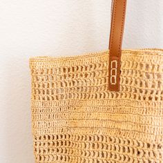 IN STOCK FAST SHIPPING FROM LOS ANGELES Chic large straw woven tote bag perfect for all occasions. This tote bag is sure to keep up with your busy lifestyle, providing a lightweight and durable design with a classic aesthetic. It’s the perfect way to stay organized while making a stylish statement. With this tote bag, you'll be ready to take on any adventure in style! Its lightweight and durable design holds up to any task while keeping your items organized. Stay on top of your game with its classic yet chic aesthetic. Natural Soft Raffia Straw Handmade Genuine Leather Handles Strap drop: 10.5 inches Size: 13.5"H x 18"W Designer Style ID: 8659 Chic Straw Bag With Open Weave, Natural Woven Straw Tote Bag, Chic Crochet Bag With Open Weave, Chic Open Weave Straw Bag, Chic Everyday Bucket Bag With Open Weave, Natural Straw Tote Bag, Chic Jute Bucket Bag With Open Weave, Natural Color Beach Bag With Open Weave, Chic Open Weave Bucket Bag For Daily Use