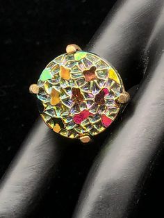 "This color changing set is oh so pretty; each round 'stone' in the bracelet and clip earrings is set in a decorative brass colored metal which measures 1 1/2\" long by 1 1/2\" wide; the ring is set in a simple setting of the same colored metal; depending on the angle, the colors reflect blue, pink, green, yellow or orange; bracelet is 7 1/2\" long, and each 'stone' is 7/8\" round; dress up or down." Gold Clip-on Earrings With Gemstone, Adjustable Multicolor Nickel-free Jewelry, Multicolor Round Gemstone Jewelry, Bronze Gemstone Jewelry, Adjustable Bronze Gemstone Jewelry, Nickel-free Oval Jewelry For Party, Costume Jewelry Round Matching Earrings, Costume Jewelry With Matching Round Earrings, Unique Adjustable Gold Clip-on Earrings