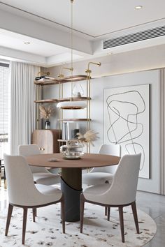 a dining room with white chairs and a round table