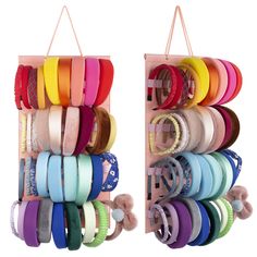 several different colored ribbons are hanging on the wall and in front of an open wooden rack