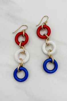 Make a statement with these unique Three Colorful Rings Earrings! Whether you want to add a pop of color to a simple outfit, or make a loud and proud fashion statement, these earrings are the perfect accessory. Add a touch of color and sparkle to your wardrobe!Details: Colorful Dangle Earrings Three Colorful Rings French Hook Ear Wire for Pierced Ears Approximate Dimensions: Length: 3.5" Rings: 0.75" DiameterRed, White and Blue ComboPink, Yellow and Purple Combo Colorful Rings, Yellow And Purple, 5 Rings, Simple Outfit, Color Ring, Pierced Ears, Ear Wire, We Wear, Body Oil