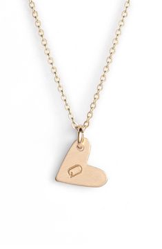 From humble beginnings to a fully staffed warehouse in Oregon, Nashelle remains true to its original purpose-handmade jewelry crafted with love and intention. The heart initial necklace is no different-with a hand-stamped pendant anchored by a single ring, it makes for a perfect layering piece. Style Name:Nashelle 14K-Gold Fill Initial Mini Heart Pendant Necklace. Style Number: 5143637. Available in stores. Everyday 14k Gold Open Heart Charm Necklace, Everyday Adjustable Heart Pendant Charm Necklace, Minimalist Heart Charm Jewelry For Anniversary, Simple Personalized Heart Pendant Jewelry, Everyday Initial Pendant Necklace With Heart Charm, Simple Heart Charm Jewelry For Mother's Day, Minimalist Heart Charm Jewelry For Anniversary Gift, Everyday Initial Heart Pendant Necklace For Mother's Day, Everyday Minimalist Heart Pendant Initial Necklace