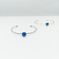 Evil eye bangle bracelet is adjustable. There is one evil eye bead on the evil eye bracelet. Evil eyes are believed to protect the person who carries them. They are also believed to bring good luck and deflect the negative energy. Charm Evil eye bangle can be a perfect gift choice for Christmas or birthday. Blue eye bracelet is also great for daily wear or special occasions. Tarnish resistant, can't be faded in along time. For more evil eye bracelets, click the link below; https://www.etsy.com/s Adjustable Metal Evil Eye Jewelry, Blue Adjustable Bangle Bracelet, Blue Resizable Bangle Bracelet, Adjustable Blue Evil Eye Bangle Bracelet, Adjustable Blue Evil Eye Bracelet, Nickel Free, Adjustable Blue Evil Eye Bracelet Nickel Free, Adjustable Nickel-free Blue Evil Eye Bracelet, Metal Evil Eye Bangle Bracelet Gift, Blue Metal Bracelets With Evil Eye