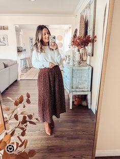 Discover stylish fall maxi skirt outfits, perfect for autumn. Learn how to layer, accessorize, and create cozy looks for all occasions. Cold Weather Skirt Outfits Modest, Maxi Skirt With Sweater Outfit, Long Flowy Skirt For Winter, Fall Pentecostal Outfits, Heartland Outfits, Maxi Skirt And Sweater Outfit, Skirt Designs For Women, Winter Church Outfits For Women, Pa Aesthetic