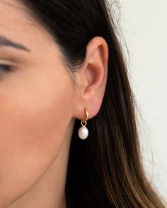 "Simple, elegant and super versatile, this dainty pair of pearl hoops is perfect to mix and match with other earrings and will easily become an everyday staple. Lightweight with an easy snap closure, and a removable pearl charm so that you can wear them with or without the pearl. * D E T A I L S * ∙ Sold as a PAIR ∙ Material: .925 Sterling Silver or 18K Gold Plated over .925 Sterling Silver ∙ Stone: Freshwater Pearl ∙ Dimensions: Inner diameter: 10mm // Pearl: Approx: 8mm (w) x 10mm (h) ∙ Hypoal Everyday Pearl Charm Huggie Earrings, Everyday Hoop Earrings With Pearl Charm, Everyday White Teardrop Huggie Earrings, Pearl Hoop Huggie Earrings, Small Hoop Huggie Earrings With Pearl Drop, Everyday Small Hoop Huggie Earrings With Pearl Drop, Everyday Small Huggie Earrings With Pearl Drop, Small Hoop Earrings With Pearl Charm, Everyday Huggie Earrings With Pearl Charm