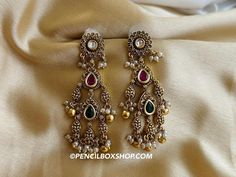 Three stone Temple Pearl Kundan Dangling temple earrings. Size : 3 approx inches Temple Style Dangle Jhumkas, Temple Jewelry Style Chandbalis With Latkans, Temple Jewelry Chandbalis With Latkans, Temple Jewelry Style Bridal Dangle Earrings, Temple Jewelry Bridal Dangle Earrings, Temple Jewelry Style Bridal Earrings, Ceremonial Temple Jewelry Earrings For Diwali, Temple Jewelry Earrings For Ceremonial Diwali, Temple Jewelry Earrings For Ceremonial Use During Diwali