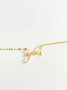 A necklace completely unique to you. Our personalised cursive name necklace is the perfect personalised accessory for you or the perfect gift for someone special. Wear your name or someone else’s around your neck every day. Our cursive font name necklace has been crafted from high-quality materials. This necklace is made to last and is suitable for everyday wear. The pendant and chain are both made of durable stainless steel, for a waterproof long lasting finish, ensuring that it will not tarnis Adjustable Personalized Gold Name Necklace, Elegant Charm Necklaces With Custom Name For Personalized Gift, Adjustable Name Necklace For Personalized Gift, Elegant Customized Nameplate Charm Necklace, Adjustable Yellow Gold Custom Name Necklace, Adjustable Yellow Gold Name Necklace, Minimalist Name Necklace For Her, Personalized Signature Name Necklace For Gifts, Personalized Adjustable Yellow Gold Name Necklace