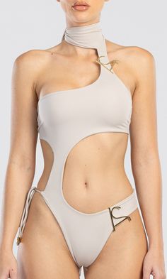 Designed with an asymmetrical shape and embellished with our AS logos, this asymmetric one piece swimwear is inspired by our signature Dulcet two piece swimwear. A stylish swimsuit featuring adjustable fastenings around the chest, neck, and bottom of the garment. With its double layered design, this piece is made of a recycled Italian fabric that ensures maximum comfort and a greater level of coverage. Model is 174 cm tall and wearing size Small, size up if you are between sizes. We are consciou Beige One Piece, Knitwear Outfit, Vacation Mood, Luxury Swimwear, Two Piece Swimwear, Compression Fabric, Dresses By Length, Designer Swimwear, Asymmetrical Design