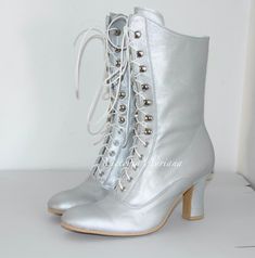 Request a Custom Order and have something made just for you! This is an individual boot execution fantastic for all seasons, great and for Victorian wedding :) Beautiful female Victorian / French High Heel Boots inspired from 1900's  booties style. All materials very qualitative Amazing Italian optic light metallic silver bright polish Leather  You can get remarkable and not expensive handmade boots.  Mid calf height: height of the heel 2,6" inch/ 7 cm length of the boot from the bottom of the s Formal Winter Lace-up Boots With Closed Toe, Formal Lace-up Boots For Winter With Closed Toe, Formal Closed Toe Lace-up Winter Boots, Formal Closed Toe Lace-up Boots For Winter, Winter Almond Toe Lace-up Boots, Silver Fitted Boots With Reinforced Heel, Fitted Lace-up Boots With Reinforced Heel And Closed Toe, Winter Silver Boots With Reinforced Heel, Silver Winter Boots With Reinforced Heel