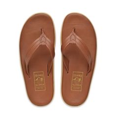 Leather Sandals - White, Navy, or Brown/Whisky Full grain Italian leather insole and strap Memory foam-like midsole for extreme comfort Rubber outsole with arch support SIZES Select same as shoe size. No half sizes. Sizes start from Men US size 4 to Men US size 16. Women order one size down. Women US 5, order Men US 4 Women US 6, order Men US 5 Women US 7, order Men US 6 Women US 8, order Men US 7 Women US 9, order Men US 8 Women US 10, order Men US 9 Women US 11, order Men US 10 COMPANY STORY Island Slipper is a small family business that makes the best slipper in Hawaii. Since 1946, we have made our slippers by hand on Oahu (Hawaii, USA). We focus on making our slippers the most comfortable and durable slippers money can buy. We use only the best materials from around the world and do no Brown Cushioned Flip Flops For Surfing, Leather Flip Flops With Arch Support For Beach, Leather Open Toe Flip Flops For Surfing, Brown Flip Flops With Arch Support, Brown Slip-on Flip Flops With Arch Support, Brown Flip Flops With Arch Support And Round Toe, Brown Open Toe Flip Flops With Arch Support, Leather Slip-on Flip Flops With Ortholite Insole, Comfortable Leather Flip Flops With Ortholite Insole