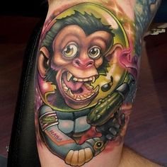 a man with a monkey tattoo on his arm