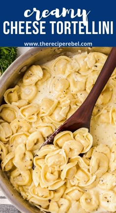 creamy cheese tortellini in a skillet with a wooden spoon