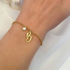 "Description:-  It will make you exciting to see your or your loved once Name Letter on this jewelry. Material: Stainless steel Plating: 18k Gold Plated, Rose Gold Plated, or Silver Plated Chain Length : 17cm, 19cm, 21cm If you want Solid Rose gold, Gold or Yellow Gold, let us know we can also make that for you on request.  Great for a birthday gift, a gift for a friend, anniversary gift, or even a gift for yourself! → [How to process the order] 1. Please tell us the Initial and stone name in the 'Personalization Box' Above For Example- J + Garnet Note:- if you not tell us stone name we will make same as picture stone. and select the finish, Size, etc from the menu option. 2. Now, click on \"Pay with Paypal\" OR \"Add to basket\" . At the checkout page, you can choose to either pay with yo Initial Bracelet Gold, Friend Anniversary, Customised Bracelets, Bracelet Initial, Gold Girl, Bracelet Metal, Letter Bracelet, Gold Rings Fashion, Jewelry Dainty