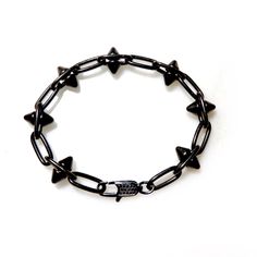 Handcrafted mens bracelet with a heavy pewter antiqued black spikes chain. Super cool and fashion forward, wear it with Jeans and a T-shirt or dressed up. Bracelet measures 7.5" Available in any custom size Made with love in Los Angeles Complimentary gift wrapping provided All sales final. Punk Black Bracelets With Spikes, Black Spiked Edgy Bracelets, Edgy Black Spiked Bracelets, Black Gothic Jewelry With Spikes, Black Punk Jewelry With Spikes, Black Punk Chain Bracelet As A Gift, Black Punk Style Chain Bracelet As Gift, Black Punk Style Chain Bracelet For Gift, Black Metal Spiked Jewelry