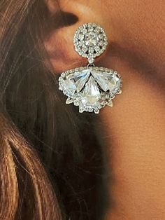 Our LEXES earrings are absolutely gorgeous and timeless to wear for a classic look. The silhouette consists of a a bigger floral design filled with crystals shaped in a leaf form to add a fine look. These will add a touch of sparkle to a stylish look. Handcrafted Highest Quality Swarovski / Cubic Zirconia Platinum plated Guards against scratches and tarnish. approximate size 1.15" length 1" width Nickel free Free Shipping in USA Glamorous Diamond White Crystal Earrings For Formal Events, Sparkling Diamond White Crystal Earrings For Evening, Formal Crystal Earrings With Diamond Accents, Formal Crystal Cluster Earrings With Sparkling Stones, Evening Diamond White Crystal Earrings With Sparkling Stones, Elegant Sparkling Cluster Earrings For Party, Elegant Diamond White Crystal Earrings, Glamorous Diamond White Chandelier Earrings For Evening, Evening Crystal Earrings With Sparkling Stones