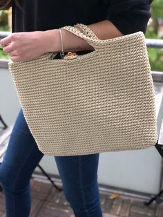 DETAILS - This beige crochet bag offers plenty of space for any document folder or your laptop. A fabric is sewn into the inside. The bag has a button closure and two handles. Dimensions (LxW) ≈ 15.4x11.8 inches (39x30 cm).      PROPERTIES - Thanks to the durable polyester material, the bag never loses its shape and is also very durable and tear-resistant.      PRACTICAL - This bag is machine washable at 30 oC and can be used immediately after washing, as they dry relatively quickly!      UNIQUE Cream Rectangular Crochet Bag For Everyday Use, Beige Rectangular Crochet Bag With Handles, Beige Crochet Tote Bag With Top Carry Handle, Everyday Beige Crochet Bag With Handles, Cream Crochet Bag With Handles For Daily Use, Everyday Cream Crochet Bag With Handles, Everyday Cream Crochet Bag, Everyday Beige Crochet Bag, Beige Bag With Laptop Sleeve For Everyday Use