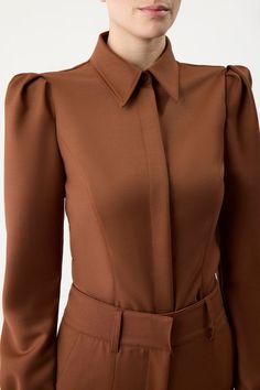 Luxury Brown Long Sleeve Tops, Fitted Business Blouse For Fall, Chic Fitted Business Tops, Chic Fitted Tops For Business, Elegant Fitted Tops With Padded Shoulders, Elegant Fitted Top With Padded Shoulders, Elegant Brown Business Tops, Elegant Brown Business Top, Formal Fitted Structured Top