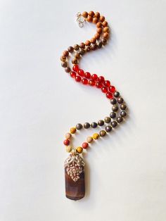 I make my own decisions with confidence and conviction. I allow my creativity to flow through me freely. I am confident in my ability to succeed. My sacral chakra is balanced. This purchase includes: Gemstone Half Mala, baggie, card including using your mala, intention setting and properties. GEMSTONES Rudraksha: Rudraksha seeds grow inside of what look like blueberries on trees in South East Asia. In Buddhism and Hinduism, the beads are believed to provide inner calm, peace, and free one from n Holistic Agate Gemstone Jewelry, Nature-inspired Agate Jewelry For Meditation, Healing Natural Stone Beaded Necklaces, Nature-inspired Beaded Necklaces For Healing With Natural Stones, Healing Natural Stones Beaded Necklace, Bohemian Jasper Jewelry For Healing, Nature-inspired Gemstone Beaded Necklace For Wellness, Healing Natural Stone Beaded Pendant Necklace, Healing Natural Stone Pendant Beaded Necklace