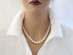 This simple Swarovski pearl necklace features graduated pearls ranging in size from 6mm up to 10mm. Measures 17 inches in length + a 2 inch extender chain. Items arrive in a beautiful hand decorated gift box. Ready to ship in 3-5 business days. To view the coordinating earrings: https://www.etsy.com/listing/228938798/swarovski-pearl-studs-bridesmaid-gift?ref=shop_home_active_18 Elegant 16 Inch Round Pearl Necklace, Elegant Formal Pearl Necklace 16 Inch, Elegant 16 Inch Pearl Necklace For Formal Occasions, 16 Inch Round Elegant Pearl Necklace, Elegant 16 Inch Pearl Necklace Gift, Elegant 16-inch Pearl Necklace Gift, Elegant White 16 Inch Pearl Necklace, Elegant Beaded Necklaces 16 Inch Length, Classic Pearl Embellished Beaded Necklace As Gift