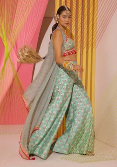 Editor's Note Step into the world of contemporary fashion with these gorgeous coordinate printed panel pants. The vibrant mix of strong floral butta and geometric jaal, delicately enhanced with... Cape Organza, Gopi Vaid, Cape Set, Indian Arts And Crafts, Beach Wedding Guests, Long Cape, Blazer Set, Couture Designers, Green Floral Print