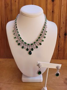 Emerald green colored crystal necklace and earring jewelry set.  Necklace is 18 inches non adjustable.  Green teardrop stones are .5 to 5 carats.  Square cut stones are 2mm to 3mm.  Center stone on earrings is 4 carats with clear crystal accents.  Earrings are 1.5 inches with a 1 inch drop.  Silver plated. Ruby Bracelet, Cameo Necklace, Set Necklace, Teardrop Necklace, Necklace And Earring Set, Wedding Jewellery, Genoa, Earring Jewelry, Square Cut