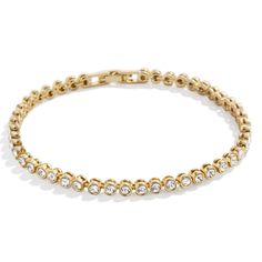 PRICES MAY VARY. Perfect For Stacking - This eternity-style Bracelet makes for an easy addition to your already-curated wrist stack. This gold and crystal band features a lineup of beautiful bezel stones and stacks perfectly with other bracelet styles. High Quality & Safe for Sensitive Skin - Made with hypoallergenic high quality, 18k gold-plated brass, our Amalie Tennis Bracelet is a durable, long-lasting piece of jewelry that is safe for sensitive skin, people with allergies, and won't turn yo Gold Cubic Zirconia Stackable Tennis Bracelet, Gold Crystal Tennis Bracelet For Anniversary, Gold Stackable Crystal Bracelet, Gold Stackable Crystal Bracelet For Everyday, Stackable Gold Crystal Bracelet For Everyday, Everyday Stackable Gold Crystal Bracelet, Enewton Bracelets Stacks, Bracelet Styles, Wrist Stack