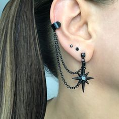 Eye catching and edgy Starburst earrings and cuff  are made of 316L Stainless steel .  Can be purchased as single or a pair. Star earrings -1 1/4 inches long Cuff is 6mm wide Short chain 1 3/4 inches MATCHING STUD IS AVAILABLE HERE: https://www.etsy.com/listing/1505099493/north-star-earring-starburst-earrings?click_key=7109df00438434e9749a84d627c791cbb97fe926%3A1505099493&click_sum=1ba011e1&ga_search_query=star&ref=shop_items_search_2&pro=1&sts=1 Goth Ear Piercings Grunge Jewelry, Different Star Designs, Arrow Ear Piercing, Ear Piercings Gothic, Black Star Earrings, Gothic Ear Piercings, Alternative Ear Piercings, Edgy Adjustable Star-shaped Jewelry, Black Metal Earrings For Alternative Fashion