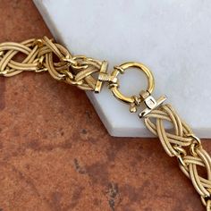 Estate/ vintage 14KT yellow gold open weave interlocking links style 15” necklace with toggle clasp. Very good condition, see pictures. Weighs approx.: 13.90 Grams 15”length, but may feel snugger on due to thickness. Very Good Estate Condition Toggle Clasp Design Luxury Elegant Chain Necklace With Toggle Clasp, Luxury Modern Jewelry With Toggle Clasp, Luxury Yellow Gold Toggle Necklace With Link Shape, Luxury Gold Lariat Toggle Necklace, Luxury Gold Link Toggle Necklace, Luxury Gold Plated Toggle Necklace, Luxury Yellow Gold Round Toggle Necklace, Luxury Gold Round Toggle Necklace, Luxury Classic Gold Chain Toggle Necklace