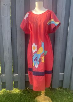 Beautiful Vintage Mexican handmade cotton dress with embroidered floral, peacock, rainbow andsunny cloud design. Relaxed fit, A-line, scoop neckline, half sleeves, ankle length and has pockets! 100% Cotton Excellent vintage condition  Fits best Women's Large - Large/ XL Measurements taken flat across in inches: neck: 8" shoulders: 20" bust: 25" waist: 27" length: 42" Red Relaxed Fit Dress For Spring, Cotton A-line Beach Dresses, Red Cotton Relaxed Fit Dress, Red Relaxed Fit Cotton Dress, Red Cotton Dress With Relaxed Fit, Relaxed Fit Red Cotton Dress, Summer Embroidered Cotton Sundress, Embroidered Cotton Sundress For Summer, Multicolor Relaxed Fit Cotton Dress