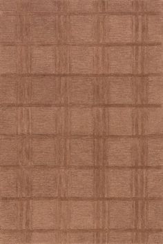 a brown rug with squares and lines on it