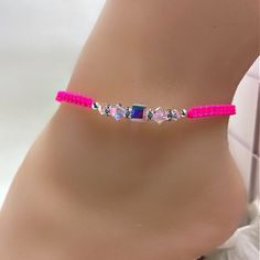 Dress up any outfit with the Swarovski Crystal Knotted Neon Pink Anklet.  The ankle bracelet is a super trendy accessory and makes a perfect gift for your best friends.  This cute anklet will be a conversation piece. Summer Party Ankle Wrap Bracelet, Adjustable Ankle Bracelet For Party, Adjustable Beaded Anklets For Party, Pink Beaded Anklets For Summer, Casual Pink Anklets For Festival, Colorful Adjustable Beaded Anklets, Summer Pink Anklet With Colorful Beads, Elegant Pink Adjustable Anklets, Elegant Adjustable Pink Anklets