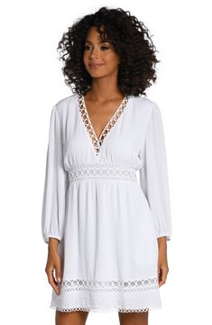 This dress gets its boho-chic vibe from crocheted details, pom-pom trim and casually cool crinkled fabric. Style with a V-neck and breezy bell sleeves, it can be worn as a dress or a cute cover-up that's ready for anything, from pool parties to music festivals. [split] Details V-neck dress Keyhole closure in back Hits above the knee Side pockets Fabric 100% Rayon Crinkle V-neck Beach Dress With Lace Trim, Breezy V-neck Beach Dress For Daywear, V-neck Beach Dress With Lace Trim As Cover-up, Flowy V-neck Cover-up For Brunch, Summer Boho Dress With Lace Trim And V-neck, Summer Boho Dress With V-neck And Lace Trim, Elegant Boho Dress With Lace Trim For Vacation, Chic V-neck Crochet Beach Dress, V-neck Rayon Tunic For Vacation