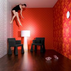 a person jumping in the air on a wooden floor next to two chairs and a lamp