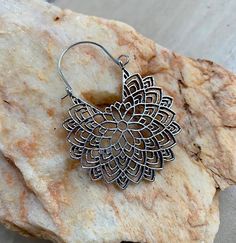 These Beautiful Lightweight Boho Dangle earrings will get many comliments. Match it with any outfit or style. Perfect gift. Gorgeous Detail.  Secure lock. 37 millimiters  Gift Wrapping available for additional $1.85 Please click here: https://www.etsy.com/listing/1345522559/gift-wrapping-options?ref=listing_published_alert Bohemian Single Drop Earring, Bohemian Teardrop Single Plug Earring, Adjustable Silver Bohemian Flower Earrings, Nickel Free Teardrop Metal Flower Earrings, Nickel-free Metal Teardrop Flower Earrings, Bohemian Sterling Silver Nickel-free Earrings, Bohemian Adjustable Sterling Silver Flower Earrings, Bohemian Nickel-free Sterling Silver Earrings, Bohemian Metal Plug Earrings With Ear Wire