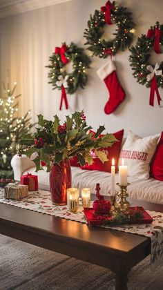 a living room with christmas decorations and candles