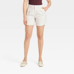 Women's High-Rise Pleat Front Shorts - A New Day™ Cream 2 High-waisted Pleated Shorts For A Day Out, Pleated Knee-length Shorts For Work, Spring Pleated Bottoms With Short Inseam, Spring Relaxed Fit Pleated Bottoms, Summer Pleated Relaxed Fit Pants, Chic Pleated Cotton Shorts, High-waisted Pleated Cotton Shorts, Beige Pleated Short Bottoms, Cotton Pleated Short Bottoms