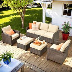 an outdoor living area with furniture and flowers