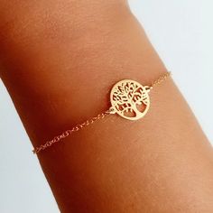 Bracelet made of 925 Sterling Silver with gold plating, decorated in its central part with a small round medal with a silhouette of the Tree of Life.  This bracelet is full of meaning and spirituality. It is an ideal gift for a friend, mother or daughter and conveys the strength of eternal connection.  The bracelet is 17 cm long and has another 3 cm extension. It is made entirely of 925 Sterling Silver and an 18-carat gold plating has been applied. ------------------------- To see more beautiful Dainty Rose Gold Bracelet For Gift, Gold Sterling Silver Name Bracelet As Gift, Gold Charm Bracelet Gift, Gold Sterling Silver Name Bracelet For Gift, Personalized Gold Sterling Silver Bracelet As Gift, Personalized Gold Sterling Silver Bracelet Gift, Personalized Gold Sterling Silver Bracelet For Gift, Dainty Gold-plated Bracelet For Gift, Delicate Gold Bracelet As Gift