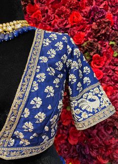 Subtle hues of whimsy blend with floral embroideries in this Royal Blue lehenga. The mehreen lehenga, embroidered with beautiful floral motifs and golden embroidery work, looks every bit of the royal self! Color - Fabric & Work Style -- Silk lehenga: Rich embroidery, floral embroidery work.- Silk embroidered blouse.- Net dupatta. Details -- Assured quality.- Wash care instruction: Dry clean only.- Slight variation in color is possible due to digital photography. Festive Floor-length Choli With Floral Embroidery, Festive Floor-length Floral Embroidered Choli, Floral Embroidered Sharara For Designer Wear And Diwali, Traditional Raw Silk Sharara With Floral Embroidery, Embroidered Dola Silk Sharara For Reception, Floral Embroidered Raw Silk Sharara, Floral Embroidered Sharara For Receptions And Festivals, Floral Embroidered Sharara For Festivals And Receptions, Floor-length Floral Embroidery Choli For Festive Occasions