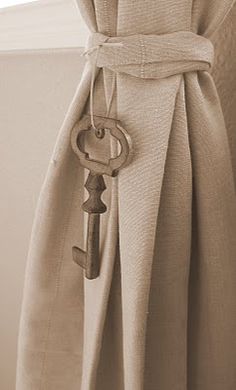 a curtain with a key attached to it