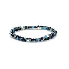 Angle Band: Flat woven; 3/8"w; glass seed beads; sterling silver clasp & 1" extender chain. Bracelet Strand A: Stretch style; 6mm gunmetal coated lava beads; 4mm natural dumortierite beads; glass seed beads; finished with a 5mm stainless steel bead. Bracelet Strands B & C: Stretch style; 3mm glass seed beads. Perfect solo or stacked. Bracelet Size Guide Modern Adjustable Beaded Bracelets With Tiny Beads, Adjustable Blue Bracelets With Black Beads, Adjustable Gunmetal Bracelet For Everyday, Adjustable Gunmetal Beaded Jewelry, Adjustable Beaded Gunmetal Jewelry, Modern Adjustable Stretch Bracelet With Round Beads, Adjustable Single Strand Beaded Bracelets, Adjustable Single Strand Beaded Bracelet, Adjustable Heishi Bead Jewelry With Black Beads