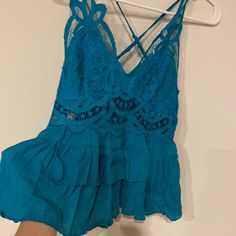 Never Worn Cross Cross Back Blue Tops With Lace Trim For Vacation, Spring Peplum Top With Lace Trim, Summer Tops With Ruffles For Night Out, Ruffle Hem Top For Night Out In Spring, Summer Ruffle Tops For Night Out, Spring Ruffle Hem Top For Night Out, Ruffle Hem Tops For Spring Night Out, Summer Ruffled Tops For Night Out, Summer Blue Tops With Lace Trim