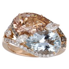 Elegant and exquisitely detailed Cocktail 18K Ring, centre set with 2.36 Cts. Pear Morganite and 2.47 Cts Pear Aquamarine. Surrounded and enhance on shank with white and chocolate colour Diamonds, weighing approx. 0.87 ct. Beautifully Hand crafted in 18 Karat Rose Gold. Stone Size: Morganite: 12 x 8 mm Aquamarine: 12 x 8 mm Gemstone Carat Weight: Morganite: 2.36 Cts. Aquamarine: 2.47 Cts Diamonds: GH-SI (white) Approx. Wt.: 0.87 Cts. (Total) Ring Size: US 7 *Ring size can be adjusted for free up Luxury Multi-stone Morganite Jewelry, Luxury Octagon Diamond Ring With Gemstone, Luxury Oval Multi-stone Diamond Ring, Luxury Morganite Diamond Ring With Diamond Accents, Luxury Morganite Diamond Ring With Accents, Luxury Morganite Diamond Ring For Anniversary, Luxury Marquise Multi-stone Diamond Ring, Luxury Round Cut Gemstones With Diamond Accents, Luxury Multi-stone Diamond Gemstones