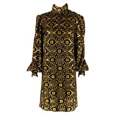 GUCCI cocktail dress comes in a black and gold viscose blend velvet features a high collar, half button closure with GG logo, long sleeve design, and long zip up closure. Made in Italy.Very Pre-Owned Condition. As-Is -2 Buttons replaced at cuffs Marked: XL Measurements: Shoulder: 15.5 inches Bust: 42 inches Waist: 42 inches Hip: 42 inches Sleeve: 28 inches Length: 38 inches Reference No.: 128764 Category: Cocktail Dress More Details Brand: GUCCI Gender: Female Size: XL Color: Black Color 2: Gold Fabric: Viscose Blend Material: Velvet Style: Long Sleeve Condition: AS IS Age Group: Adult Png Clothes, Long Sleeve Cocktail Dress, Bergdorf Goodman, Velvet Fashion, Gold Fabric, High Collar, Sleeve Designs, Day Dresses, Zip Ups