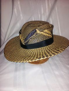 This style is made in hand woven panama straw which gives UV sun protection.  The style can made in this black and natural or brown and natural in this pattern, or a solid color as well. Contact me for available colors. The crown has two hand sculpted tear drop shaped ridges. The brim is slightly narrower in the back which adds to the feminine profile of the hat. The trim is hatband 1" black grosgrain ribbon. This style is functional and beautiful with a nice nod to a vintage silhouette and a mo Woven Straw Panama Hat For Rodeo, Straw Woven Panama Hat For Rodeo, Western Style Woven Toquilla Straw Sun Hat, Western Woven Toquilla Straw Sun Hat, Brown Woven Fedora Straw Hat, Brown Woven Straw Fedora, Western Style Woven Straw Panama Hat, Western Woven Straw Panama Hat, Artisan Woven Panama Hat With Short Brim