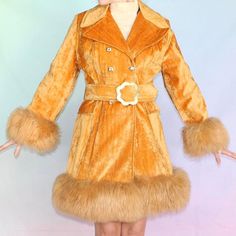 "Vintage 60s 70s penny lane coat Orange velveteen princess coat with wide collar faux fur trim and matching flower power belt new with original tags!! Label: Montgomery ward  Overall excellent vintage condition, belt buckle shows age (see video) ▫️ velveteen orange shell  ▫️ orange satin lining  ▫️ long orange fuax fur at the cuffs and hemline  ▫️ wide butterfly collar  ▫️ matching thick belt with silver flower buckle (built in belt loops) ▫️ two front pockets  📀 measurements 📀 Pit to pit: 17\ Authentic 70s Fashion, 70s Western Fashion, Leopard Fur Coat, Thick Belt, Penny Lane Coat, Princess Coat, 60s And 70s Fashion, 70s Outfits, Orange Satin